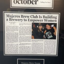 Newspaper article found at Mujeres Brew House, about the mission of the brewery